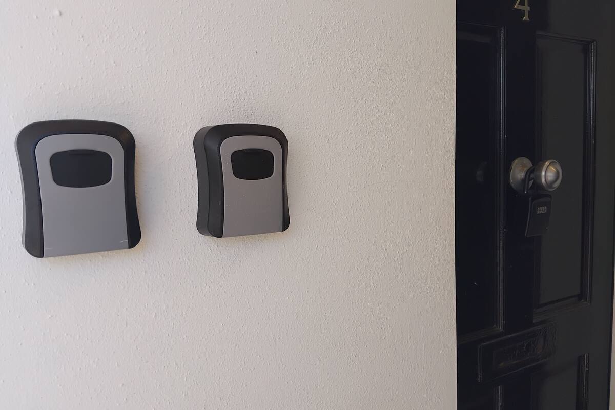 A door with a numeric keypad and a doorbell.