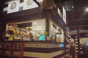 A reception area with a counter, a sign reading 'The Barat,' and a reception desk. - The Barat Perhentian (Besut)