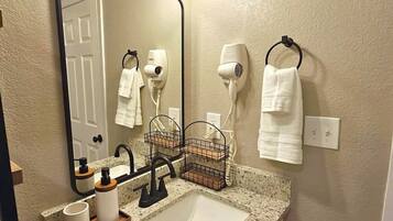 Hair dryer, towels, soap, toilet paper