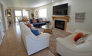 Smart TV, fireplace, table football, books