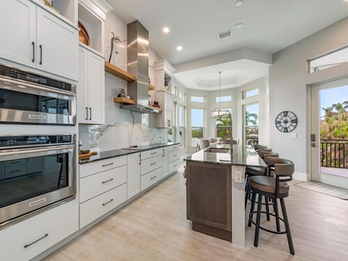 Luxury Waterfront Retreat - 6BR - Heated Pool - Walk to Beach