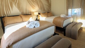 A hotel room with two beds, a large window with curtains, and a wall with a palm leaf design. - Aviles Double Full- 5 min walk to beach! (St. Augustine)