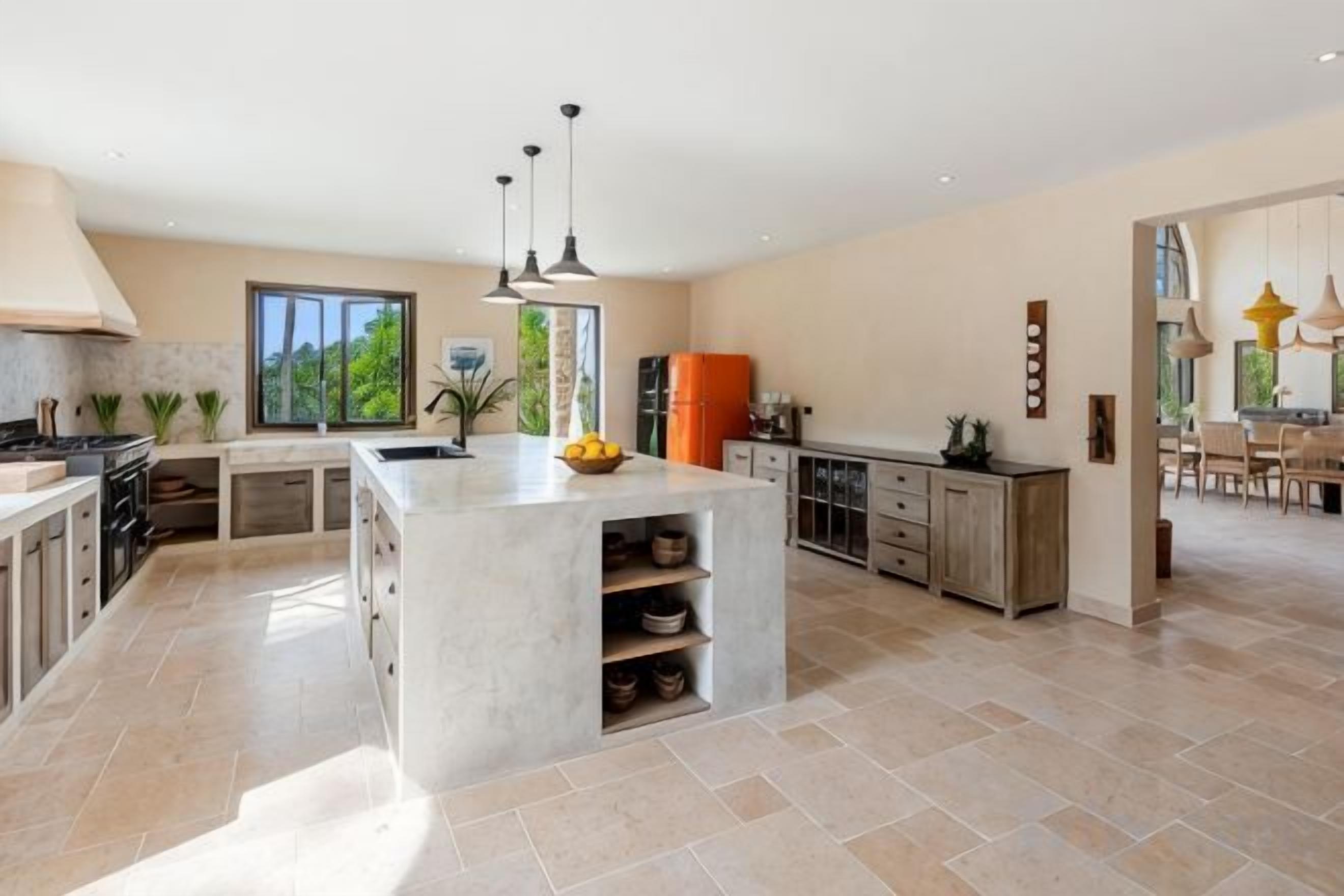 A spacious kitchen with a large island, modern appliances, and ample counter space.