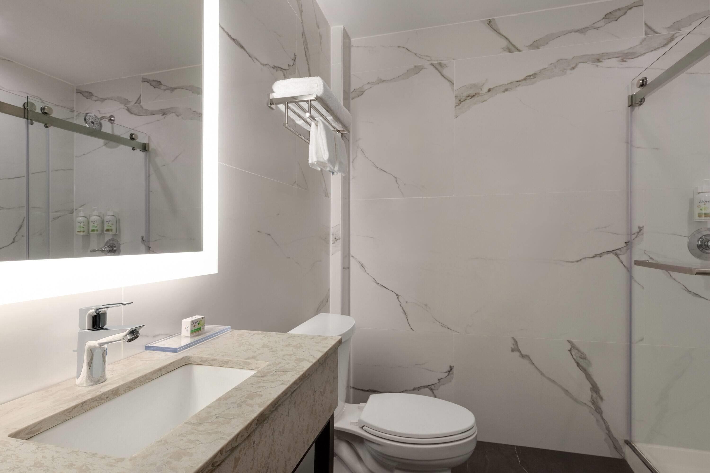 Shower, rainfall showerhead, hair dryer, towels