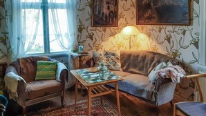 A cozy living room with a sofa, a small table with a lamp, and a patterned rug. - 2 bedroom gorgeous home in åsensbruk (Åsensbruk)