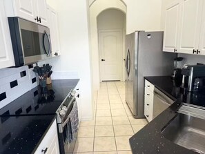 Fridge, microwave, oven, stovetop - Dream Villa W/ Pool Near Disney3 Bed 2 Bath, (Davenport)