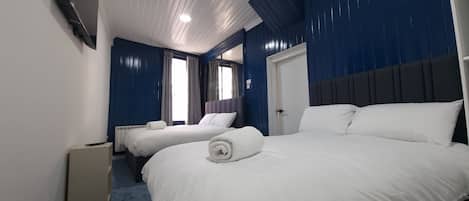 Family Room | 1 bedroom, Select Comfort beds, iron/ironing board, free WiFi