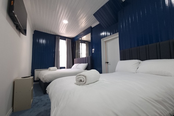 Family Room | Select Comfort beds, iron/ironing board, free WiFi, bed sheets