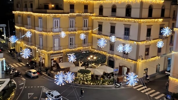 A multi-story building with balconies and a central courtyard.