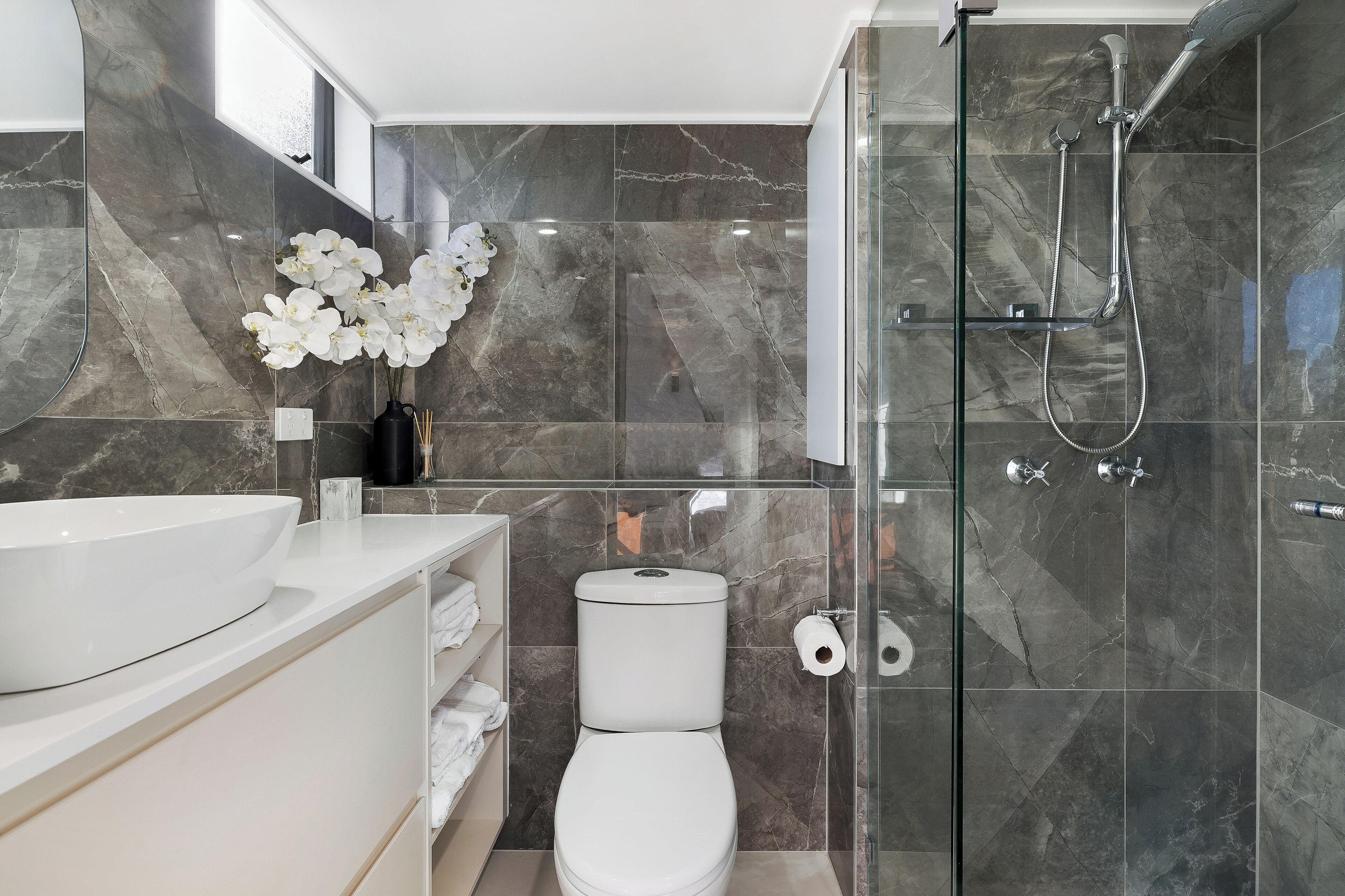 Shower, hair dryer, towels, toilet paper