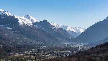 A mountainous landscape with a valley town.