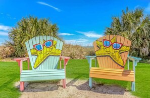 Two beach chairs with starfish designs.