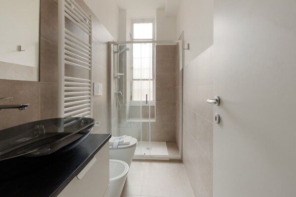 Shower, hair dryer, bidet, toilet paper