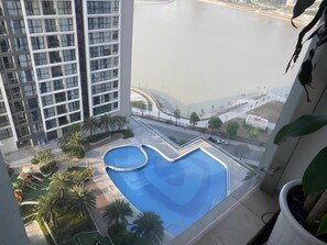 2 outdoor pools, pool umbrellas, pool loungers - Sunny - Vinhomes Skylake Residences (Hanoi)