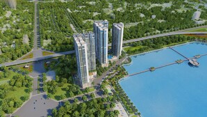 A high-rise residential building complex with a waterfront view, connected by a bridge, and surrounded by greenery. - Sunny - Vinhomes Skylake Residences (Hanoi)