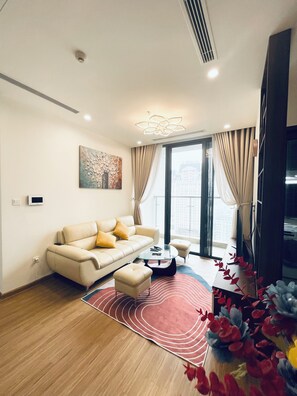 Apartment, 2 Bedrooms | Living area | 42-inch TV with cable channels - Sunny - Vinhomes Skylake Residences (Hanoi)