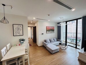 Apartment, 2 Bedrooms | Living area | 42-inch TV with cable channels - Sunny - Vinhomes Skylake Residences (Hanoi)