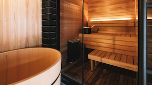 A sauna with wooden benches and a large wooden tub. - RITA Unnan Yoshida (Unnan)