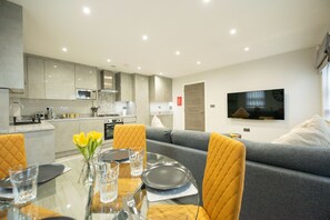 Apartamento premium, suíte | Lounge