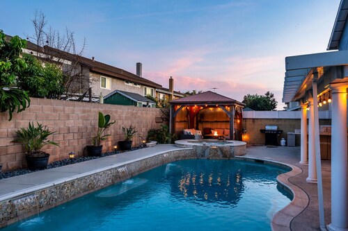 Private 4-bedroom pool home with 2 primary suites with heated pool, jacuzzi, fire pit, and outdoor dining. Minutes to Disneyland, Knott’s, and Orange County beaches.