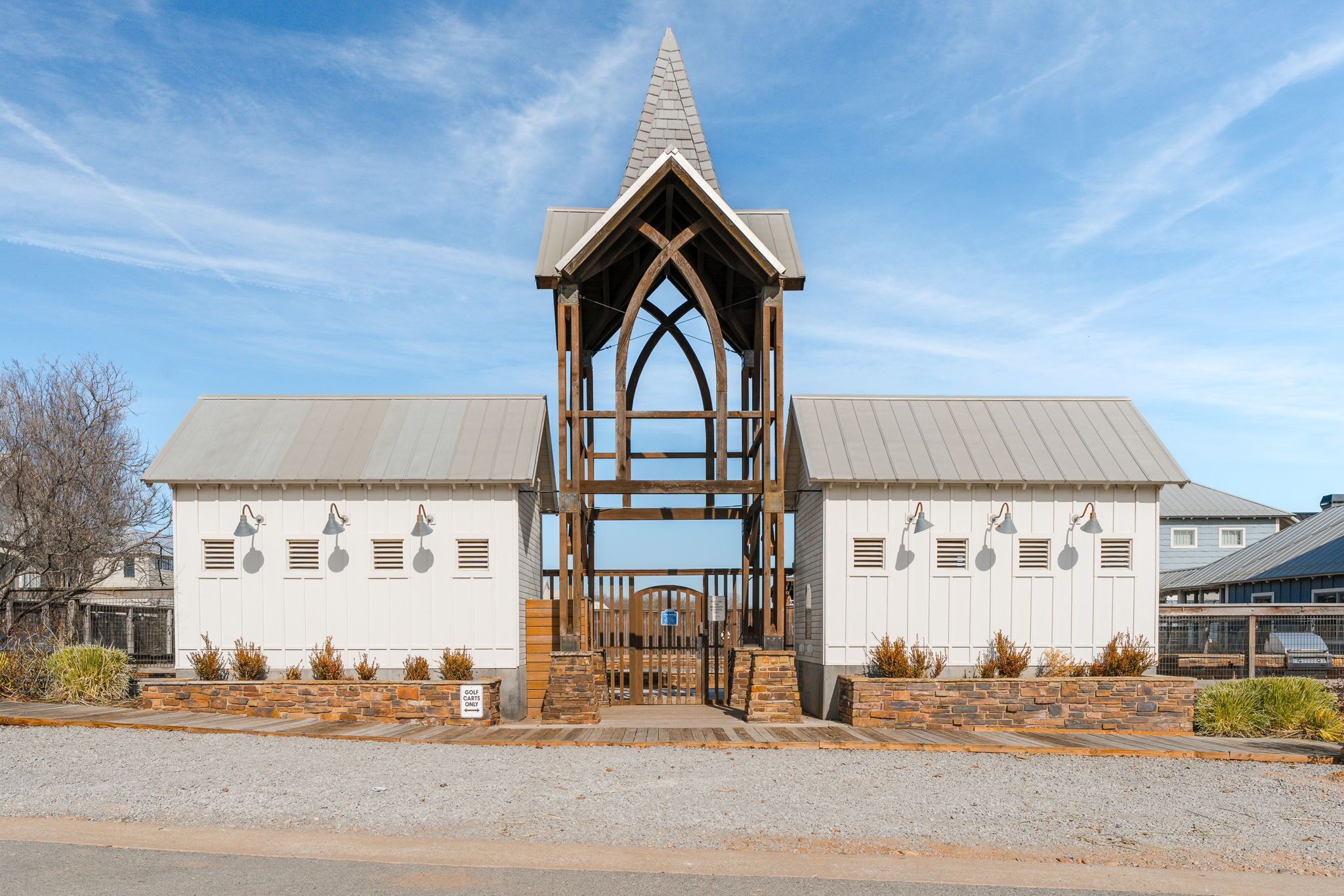 A building with a pointed roof and a central wooden archway.