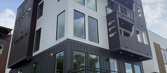 Skyrise Stay - New 5-Story w/ Rooftop Bar, Hot Tub, Elevator & Skyway Bridge