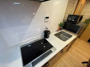 Fridge, microwave, cookware/dishes/utensils