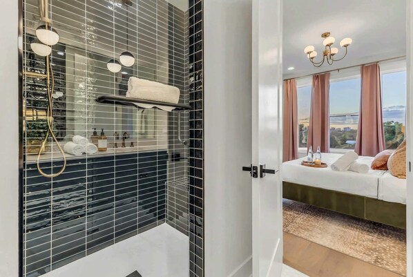 Shower, hair dryer, towels, shampoo