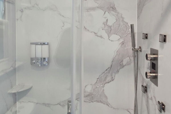Shower, hair dryer, towels, soap