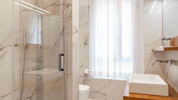 Shower, hydromassage showerhead, designer toiletries, hair dryer
