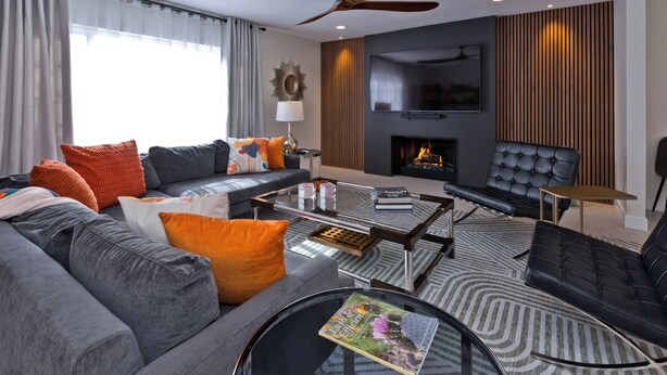 A modern living room with a sofa, coffee table, and a fireplace. - Escoba Ranch, spectacular property, large yard and citrus grove, License #064010 (Palm Springs)