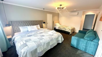 1 bedroom, desk, iron/ironing board, travel crib