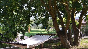 A hammock tied between trees in a park setting. - Borgo Santa Maria Privat Pool Wifi (Monteleone d'Orvieto)