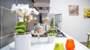 Fridge, microwave, stovetop, dining table