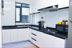 Classic Apartment | Private kitchen | Full-size fridge, microwave, oven, cookware/dishes/utensils - Staroot Residences- Celestial Chalet (Nairobi)