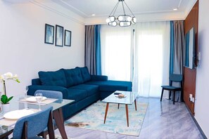 Classic Apartment | Living area | 50-inch Smart TV with cable channels, Netflix, first-run movies - Staroot Residences- Celestial Chalet (Nairobi)