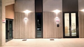 A building entrance with a reception area, marked by a sign indicating 'Bed & Bike Hostel Reception'. - Bed and Bike Hostel  (San Giovanni in Persiceto)