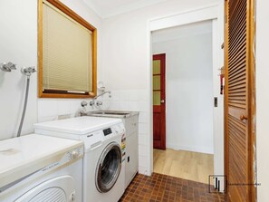 Shower, hair dryer, towels, toilet paper
