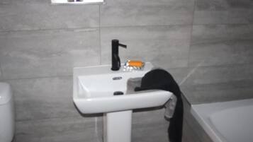 Shower, towels, soap, toilet paper