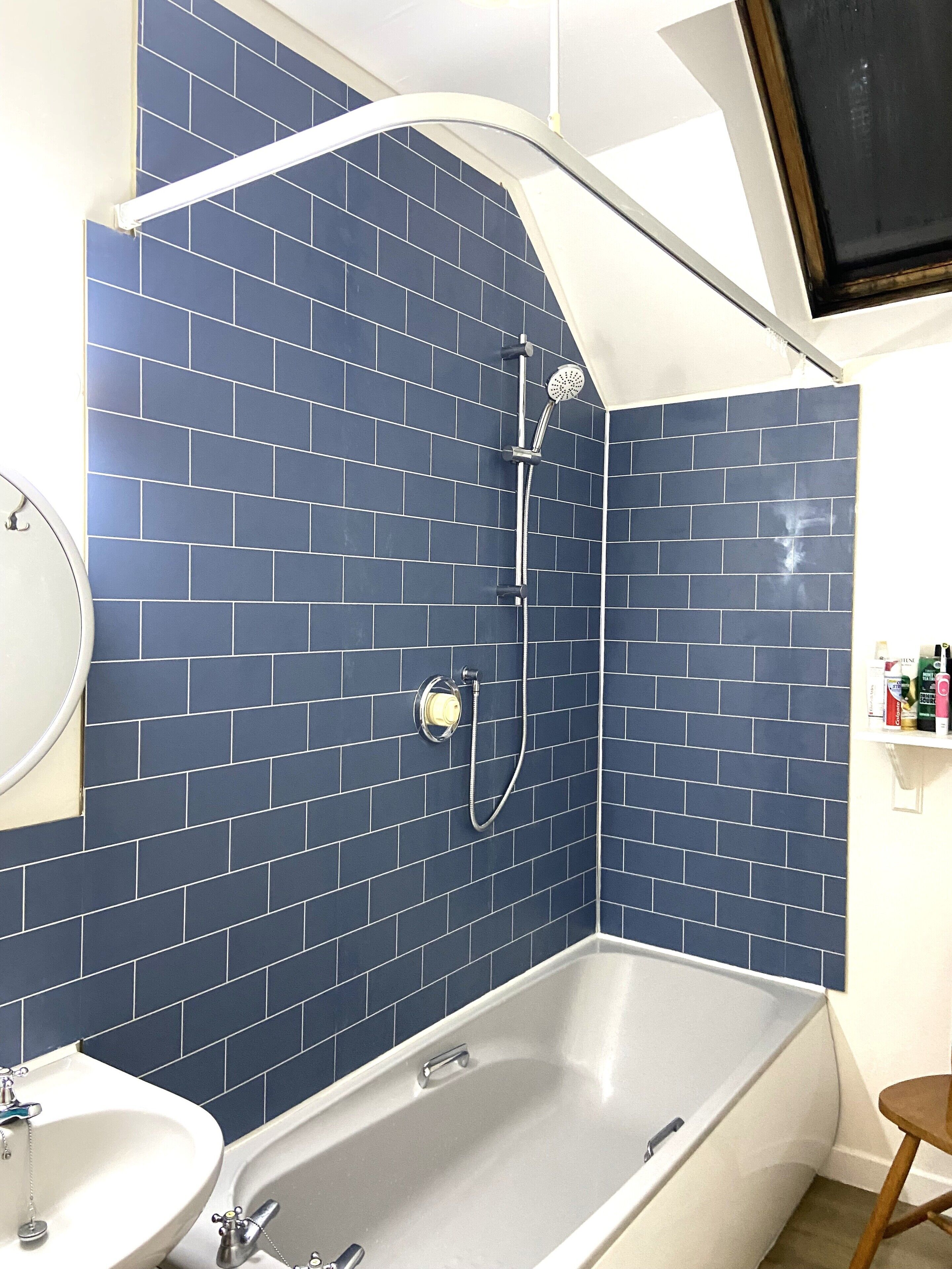 A bathroom with a bathtub, a shower, and a sink.