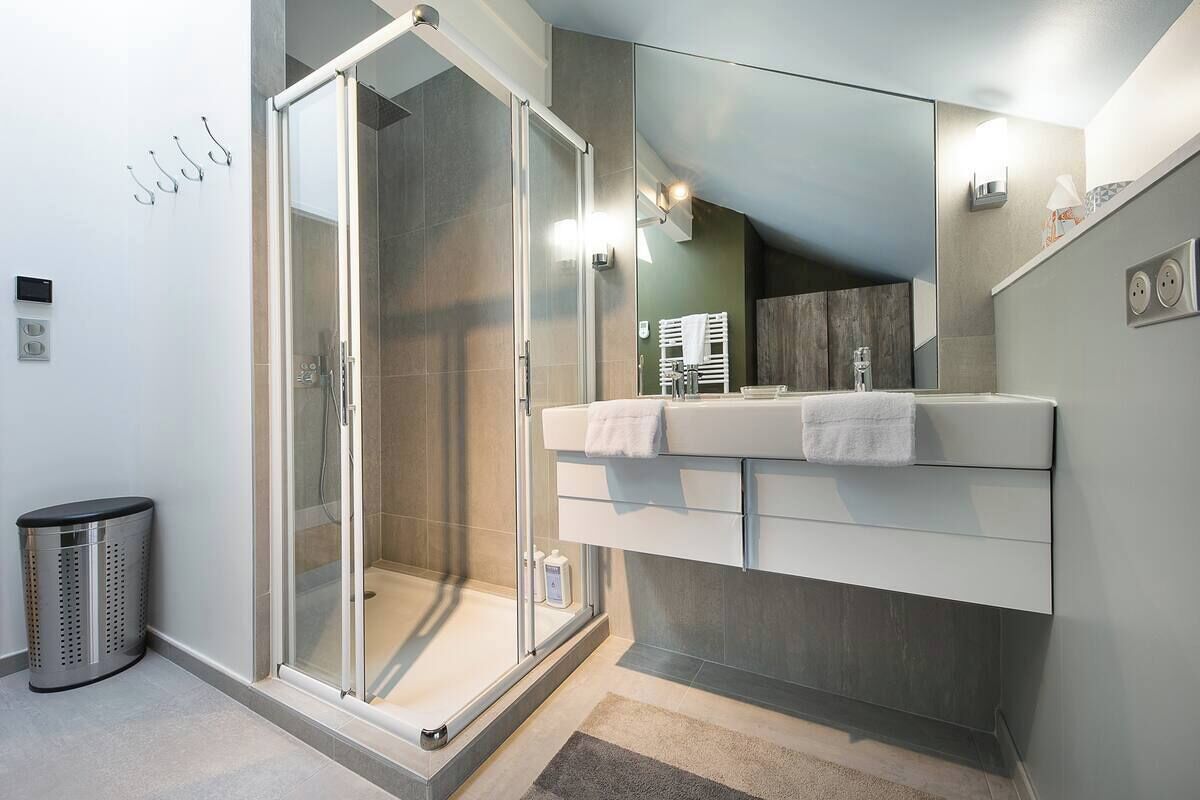 Shower, hair dryer, towels, toilet paper