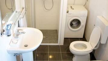 Shower, hair dryer, towels, toilet paper