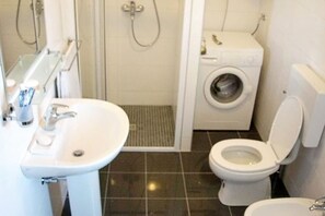 Shower, hair dryer, towels, toilet paper