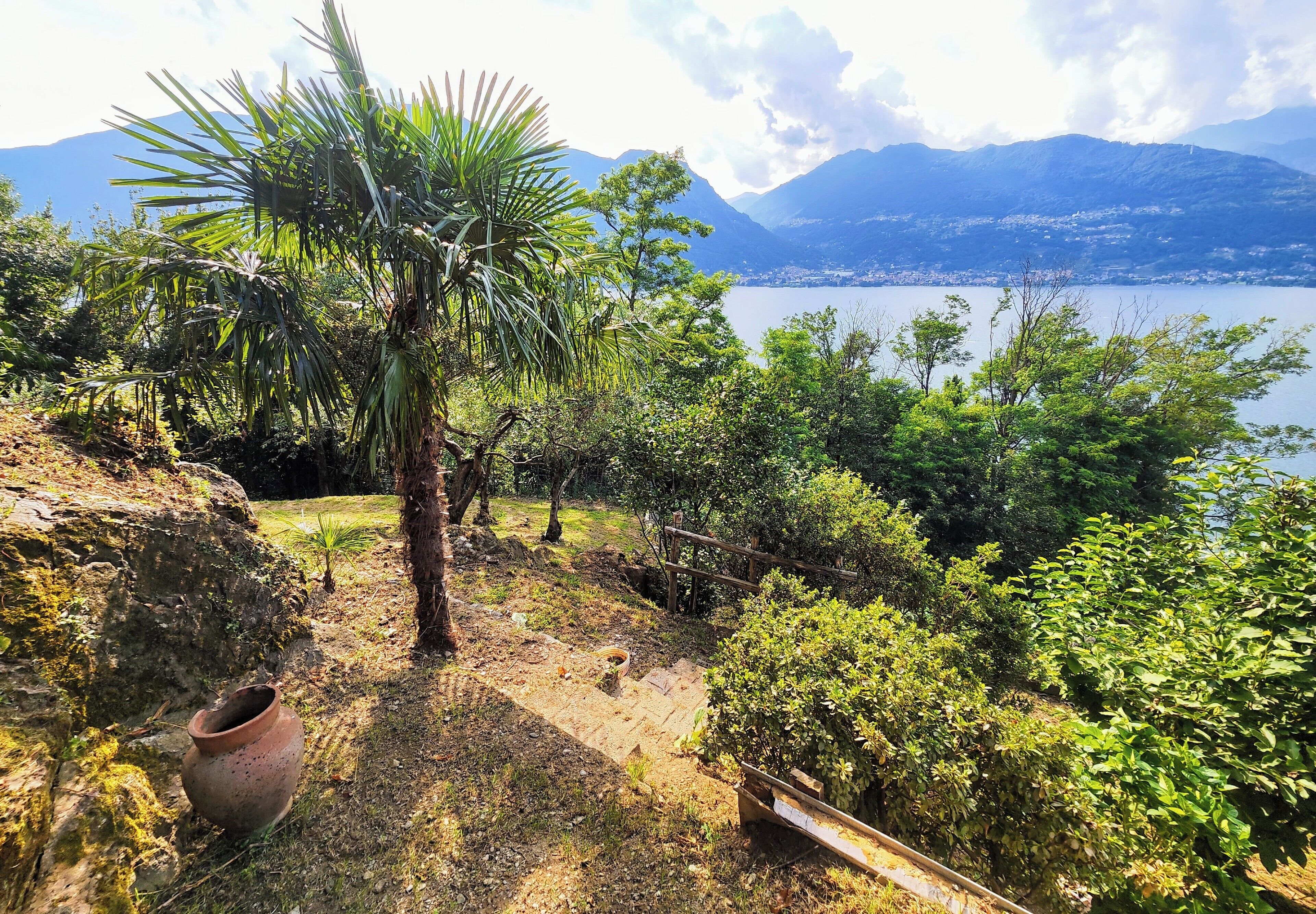 A natural landscape with a view of mountains and a lake.
