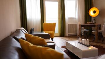 Comfort Apartment, Non Smoking, Balcony | Living area | 50-inch flat-screen TV with cable channels