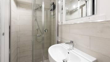 Basic Apartment | Bathroom | Free toiletries, hair dryer, towels, toilet paper