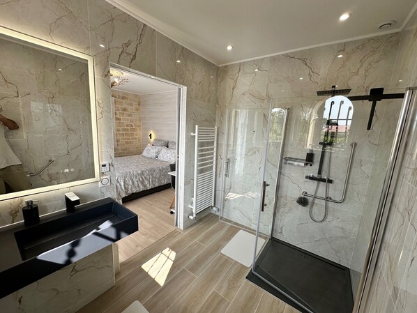Shower, hair dryer, towels, soap