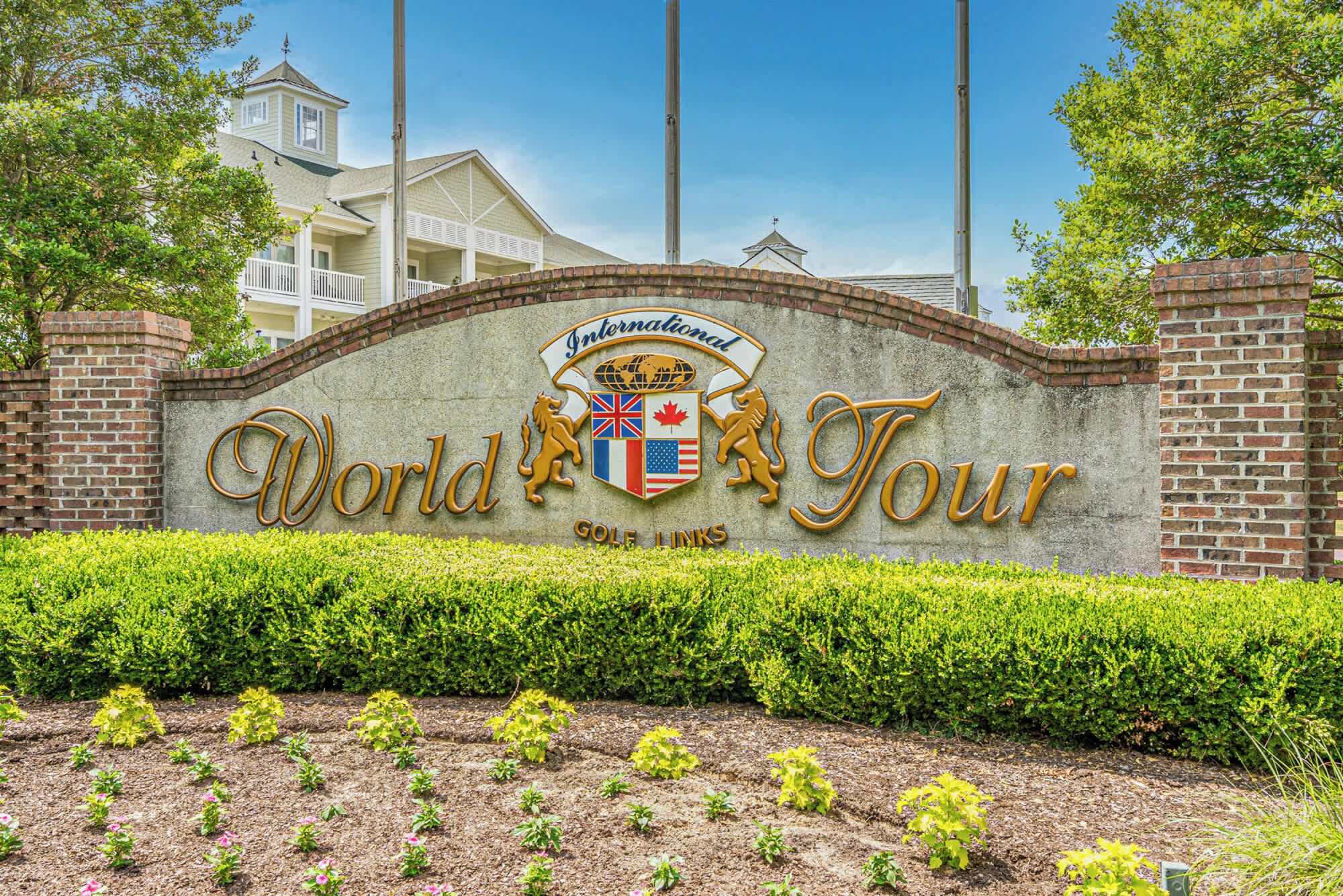 A sign for the International World Tour with a globe, flags, and a lion emblem.