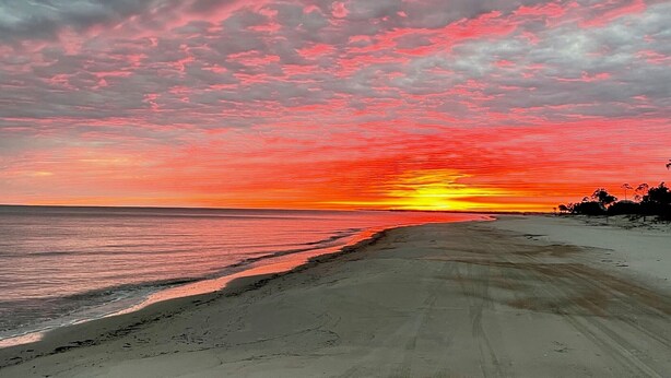 A beach with a sunset. - RV LOT Pole barn is fully covered and concreted Indian Pass (Port Saint Joe)