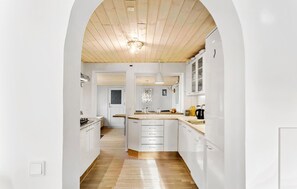 Fridge, stovetop, dishwasher, coffee/tea maker